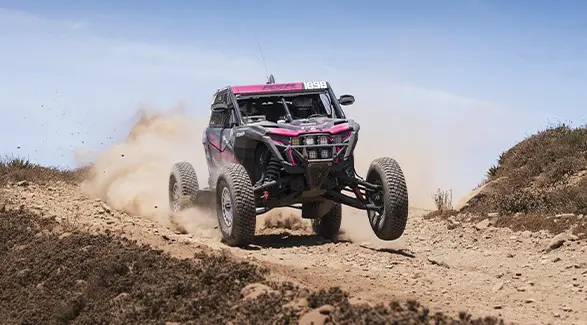 2025 Polaris RZR Pro R Factory SxS descending a rocky hill.