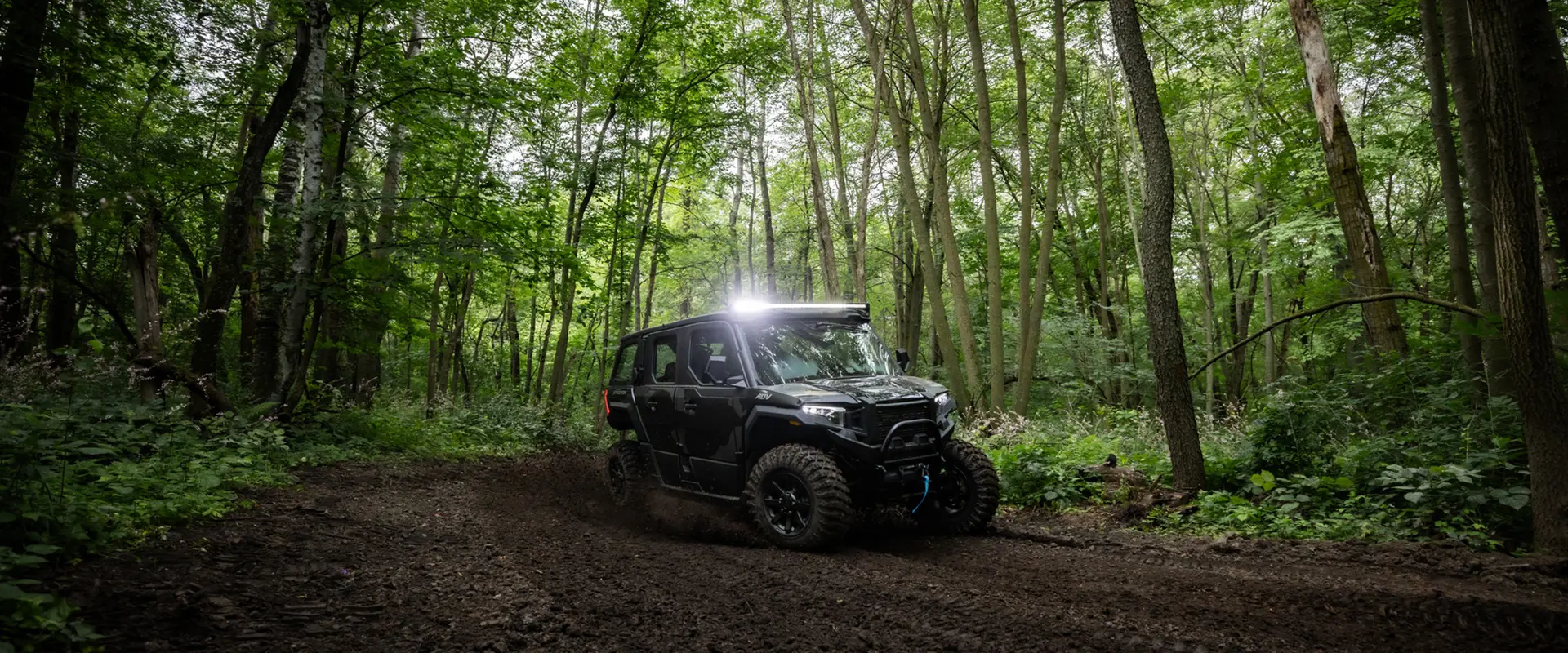 A 2026 Polaris XPEDITION ADV 5 NorthStar side-by-side taking a tight corner with ease.