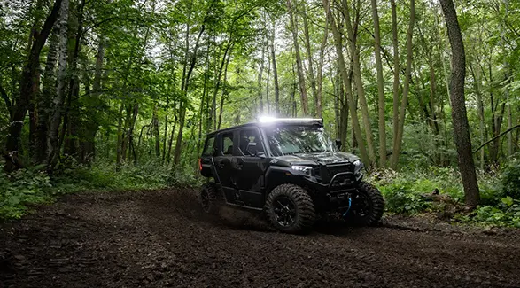 A 2026 Polaris XPEDITION ADV 5 NorthStar side-by-side taking a tight corner with ease.