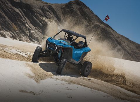 A driver in a Polaris RZR showcasing the precision handling. 