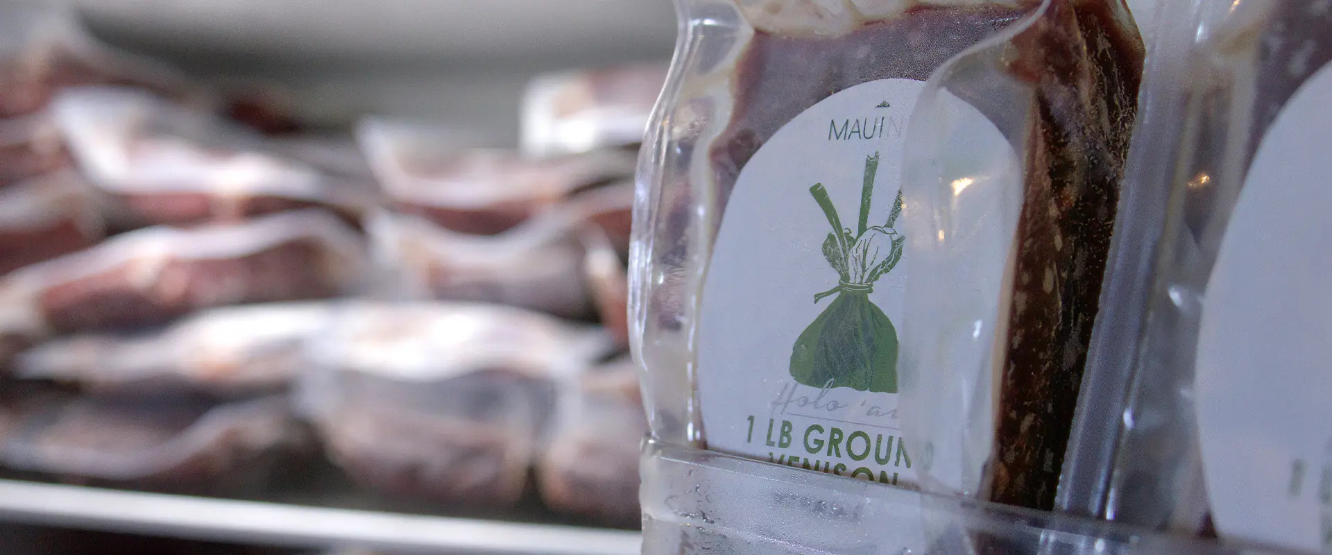 Close-up of a vacuum-sealed 1 lb package of Maui Nui Ground Venison.