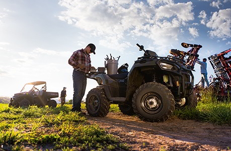 Two Ranchers using their Polaris Sportsman and Ranger