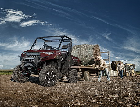 A rancher loading the Ranger XP 1000 towing bed