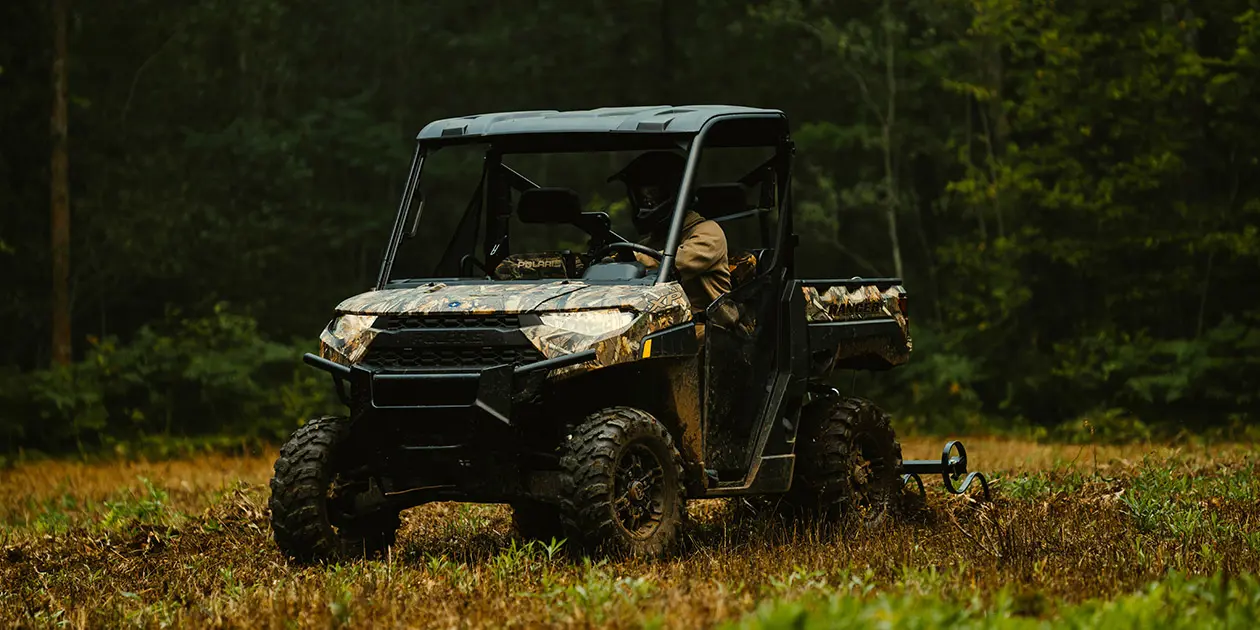 A mand driving his Ranger XP 1000 Hunting Edition