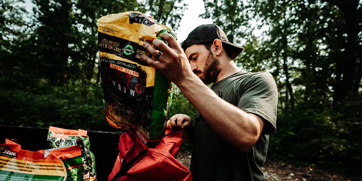 A man prepping up some seeds to plant in the ground