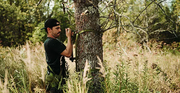 Man in front of tree
