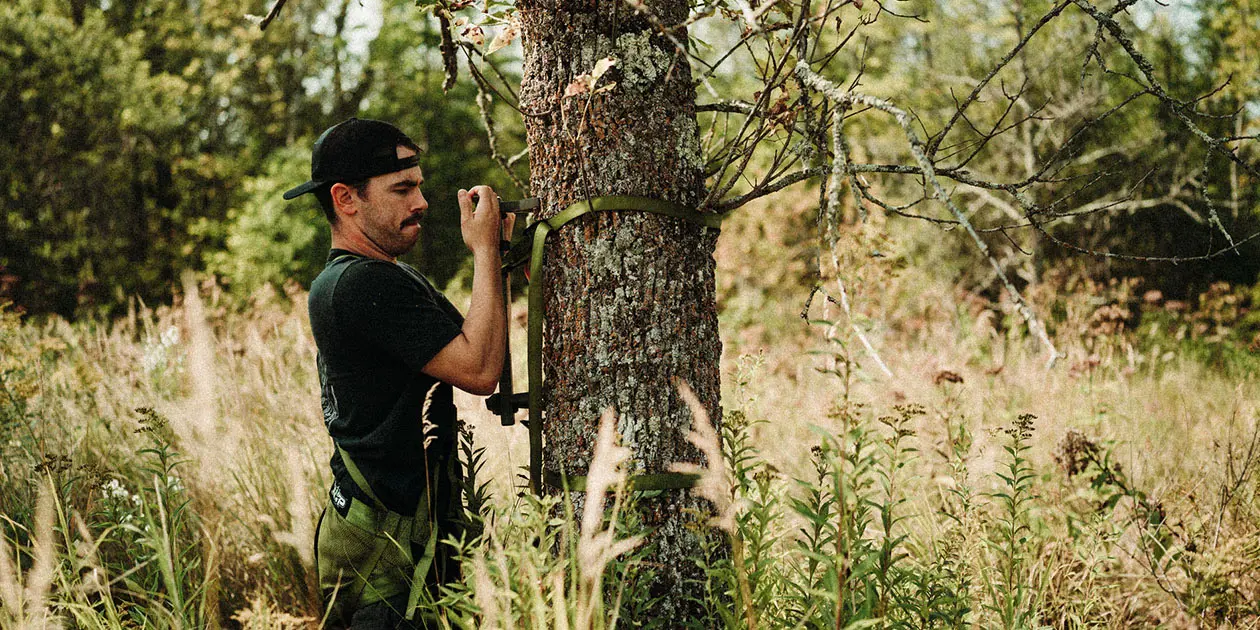 Man in front of tree