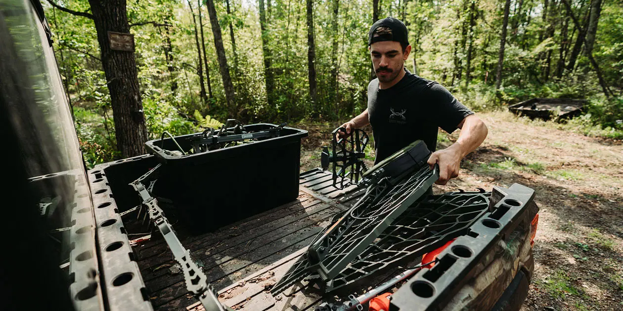 Man loading equipment in a Ranger cargo box