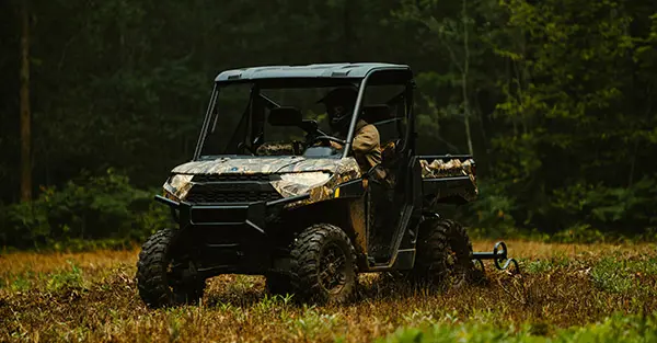 A mand driving his Ranger XP 1000 Hunting Edition