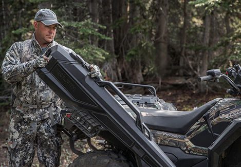 Hunter unloading his equipment from a Sportsman XP 1000 Hunting Edition