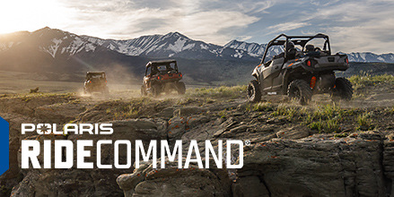 a group of Polaris Generals heading into a trail
