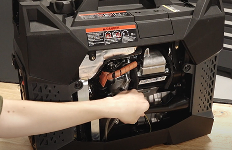 a man viewing a p2000i generator on a desk