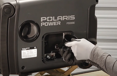 closeup of a man working on a p3200ie generator