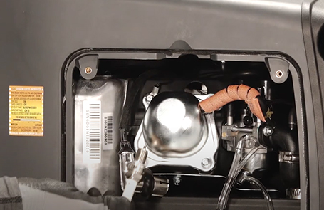 closeup of the generator to show where the sparkplug is located
