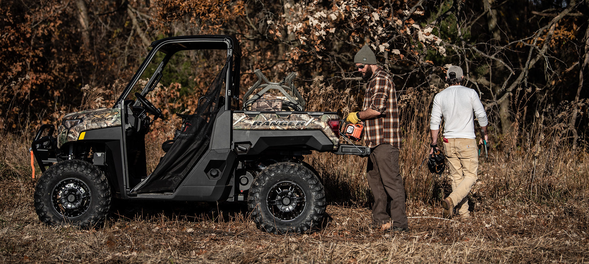 Side view of a Ranger XP 1000 Big Game Edition in the woods
