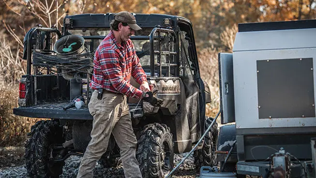 A Ranger owner walking in front of his vehicle