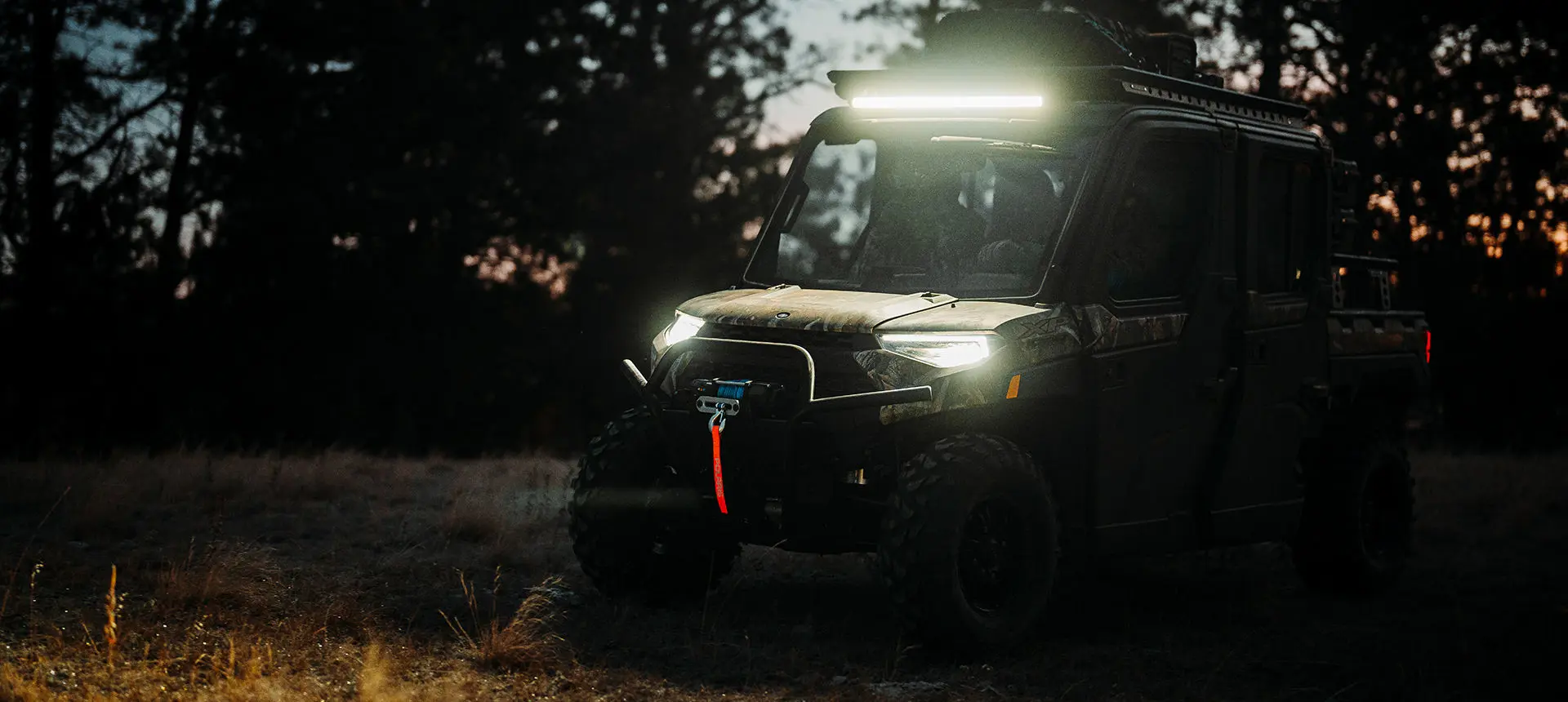 headlights and light bar illuminated on a polaris ranger crew xp 1000 northstar big game edition utv
