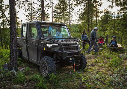Ranger Crew XP 1000 NorthStar Edition parked in woods