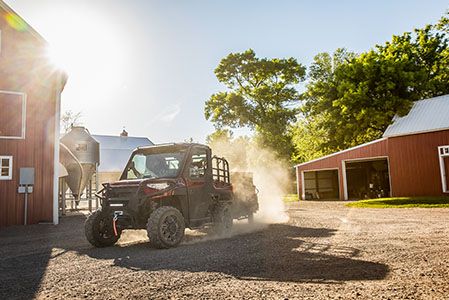 Ranger XP 1000 NorthStar Edition on a trail near a farm