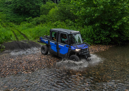 RANGER SP 570 with accessories installed from the trail collection crossing a river