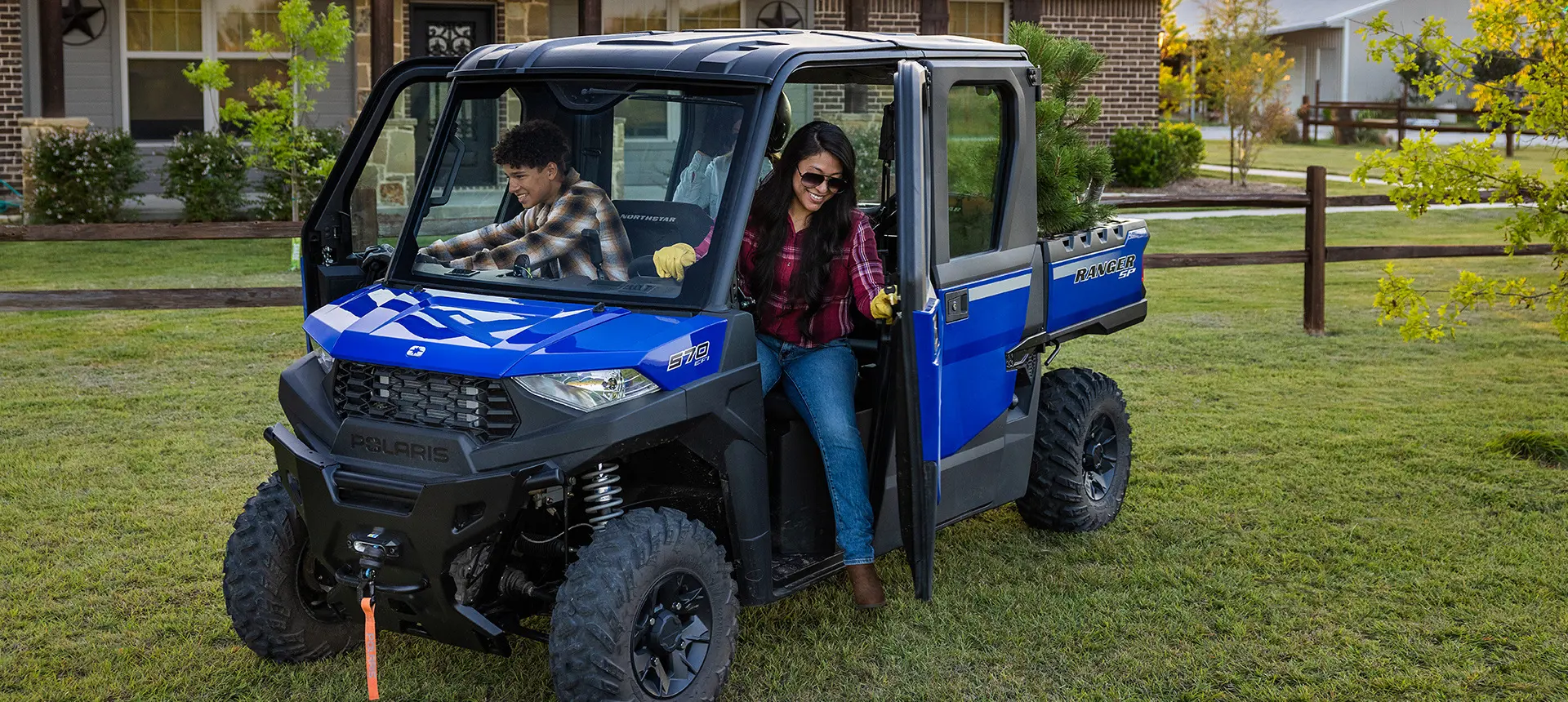 Family getting out of the cab of the RANGER CREW SP 570