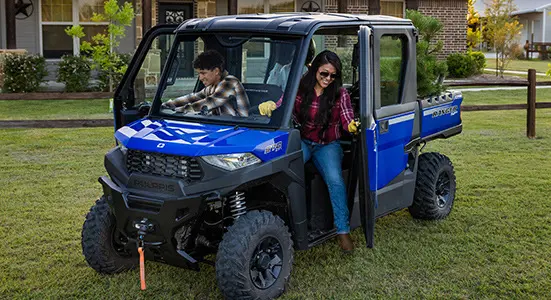Family getting out of the cab of the RANGER CREW SP 570