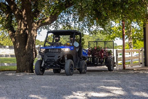 RZR 570 going down a green trail road