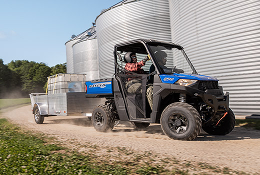 RZR 570 going down a green trail road