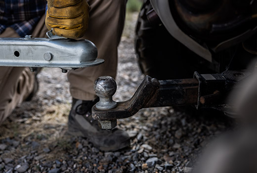 RZR 570 going down a green trail road