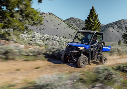 RANGER SP 570 riding smoothly down a well-groomed trail