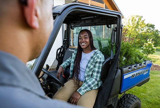 RZR 570 going down a green trail road