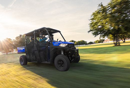 RZR 570 going down a green trail road