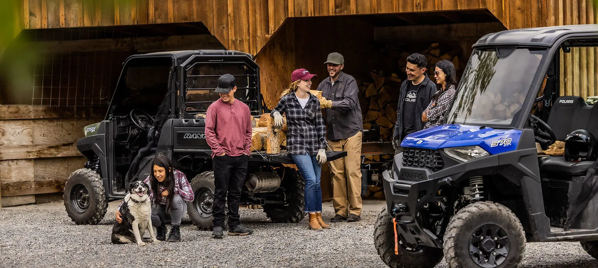 Group of friends relaxing near their RANGER SP 570 utvs