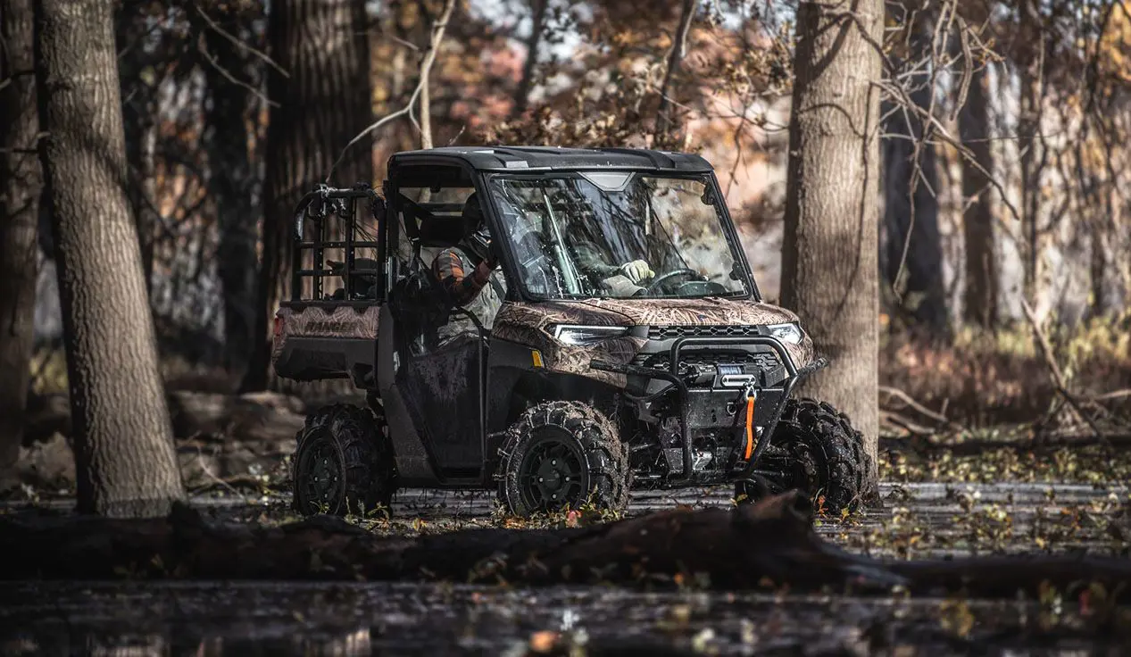 polaris ranger xp 1000 waterfowl edition utv cruising through swampland