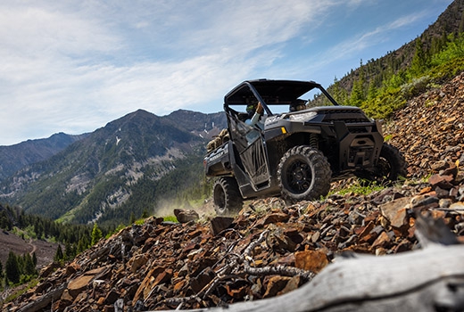 RZR 570 going down a green trail road