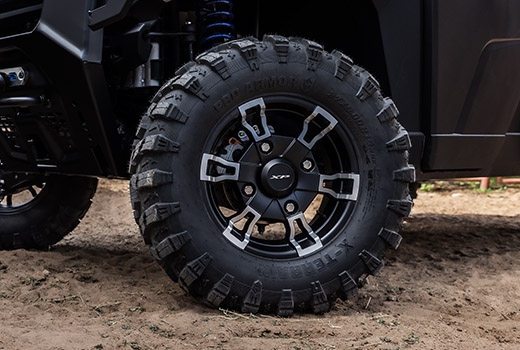 RZR 570 going down a green trail road