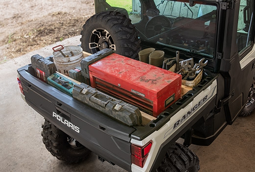 RZR 570 going down a green trail road