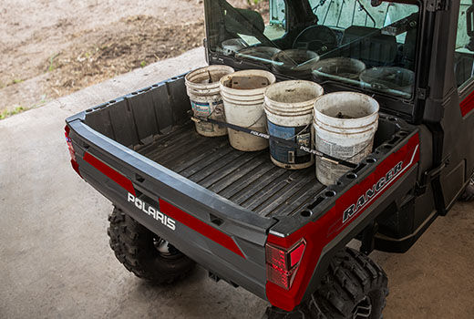 RZR 570 going down a green trail road
