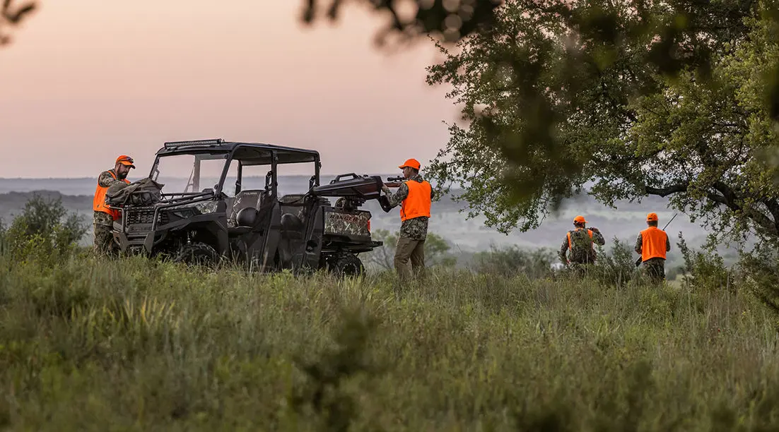 farmers gathering gear from their ranger crew 570 full-size utv
