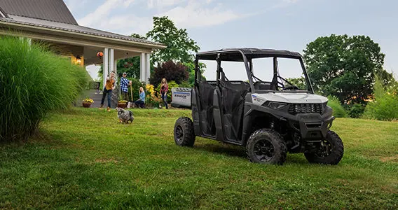 family playing near their ranger crew sp 570 utv