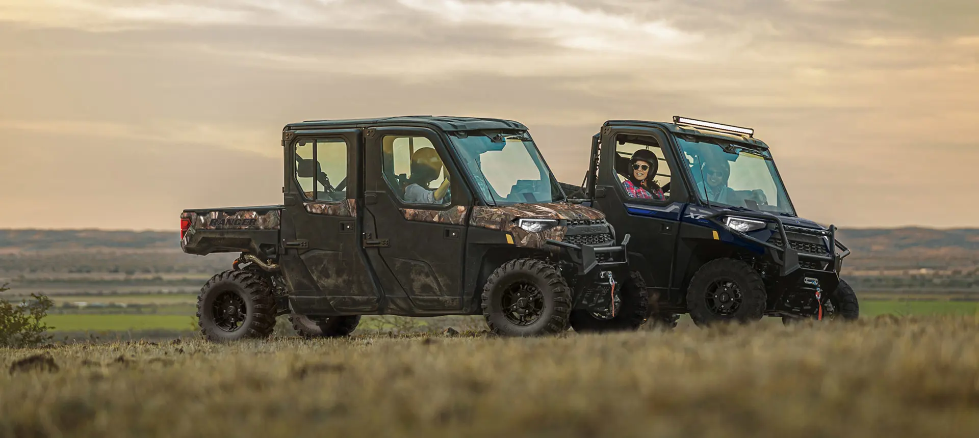 Ranger XP 1000 and Ranger Crew XP 1000 UTVs parked while owners chat