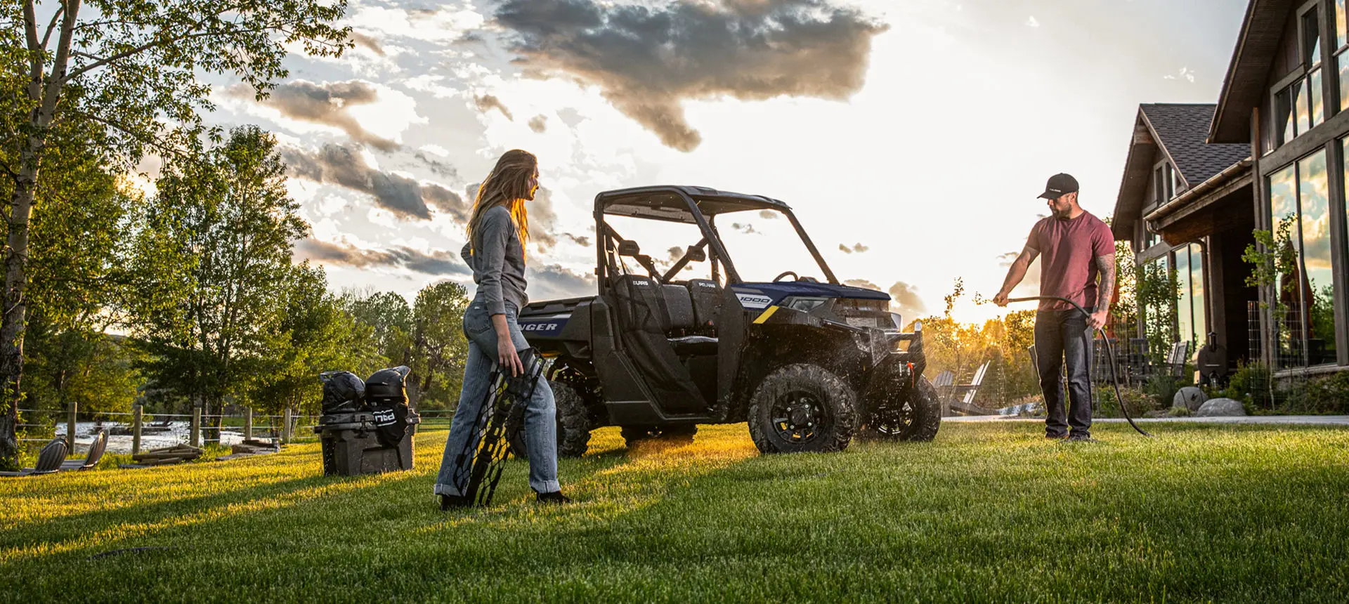 couple washing their ranger 1000 utv