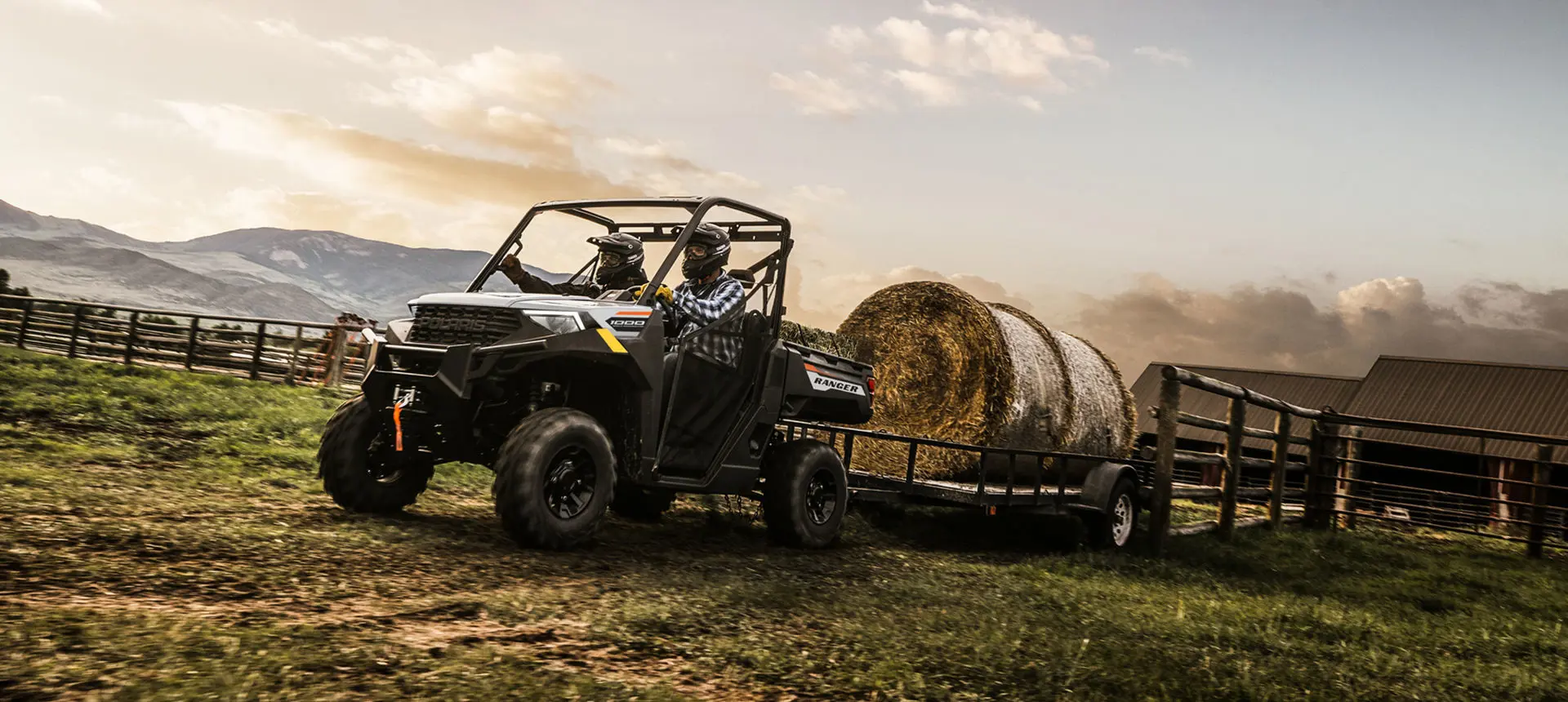 ranger 1000 utv pulling a heavy trailer with a hay bale on it