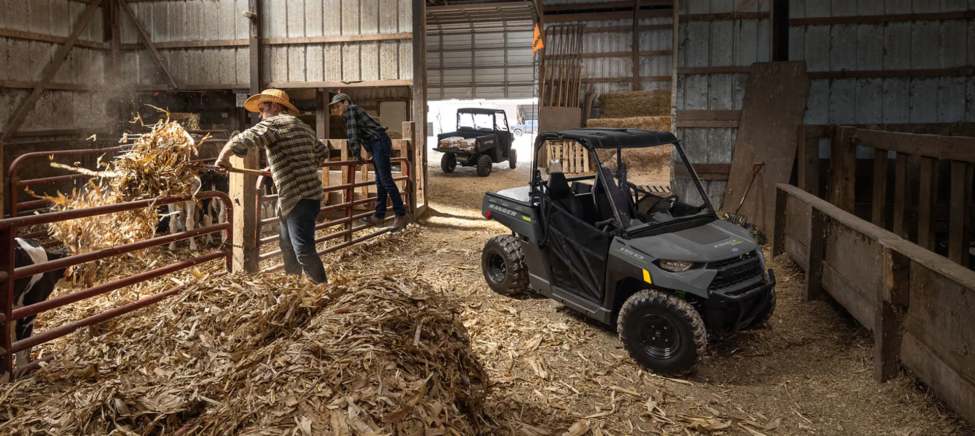 kid and dad feeding hay near a RANGER 150 EFI UTV