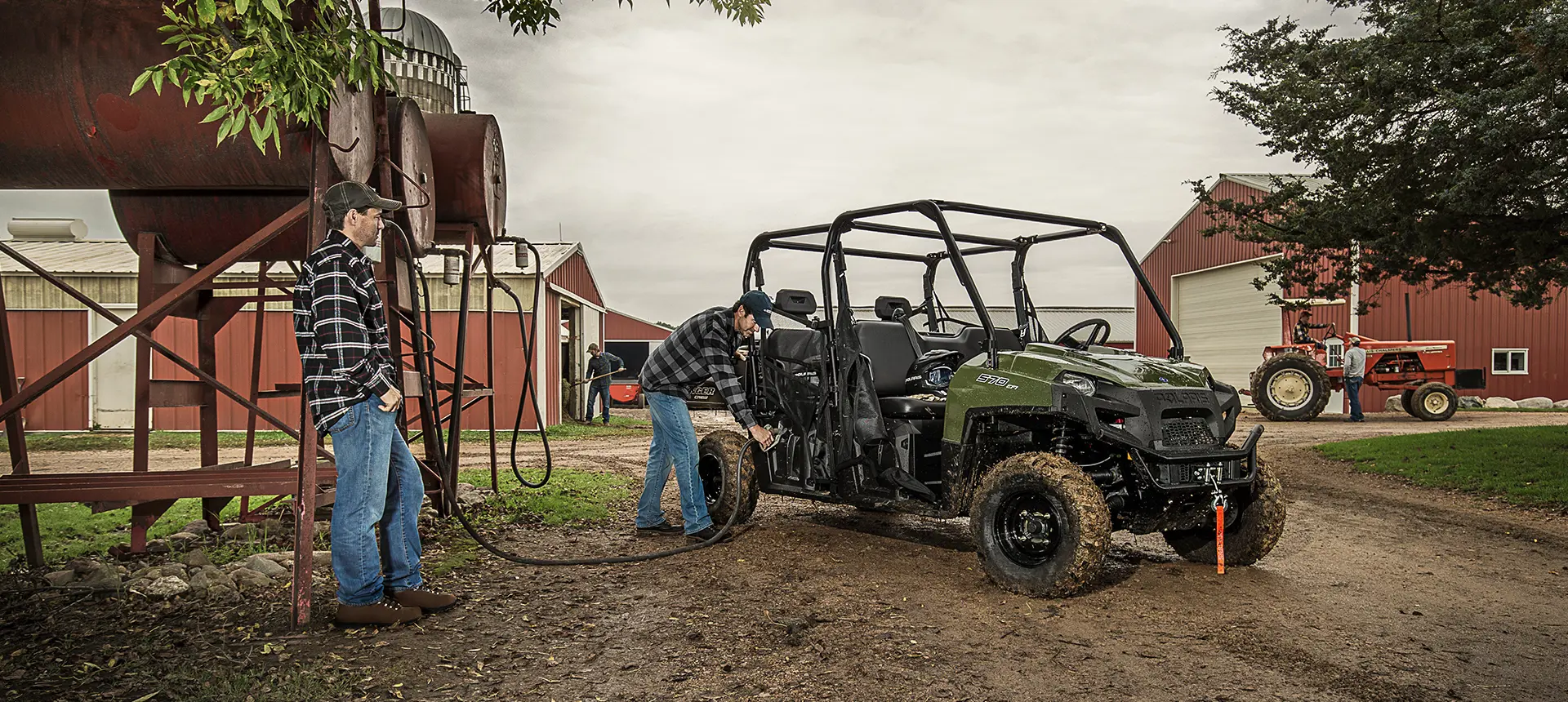 man putting gas into his polaris ranger crew 570 full-size