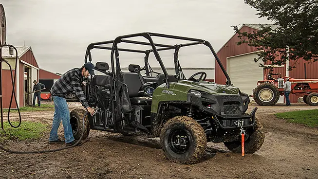 man putting gas into his polaris ranger crew 570 full-size