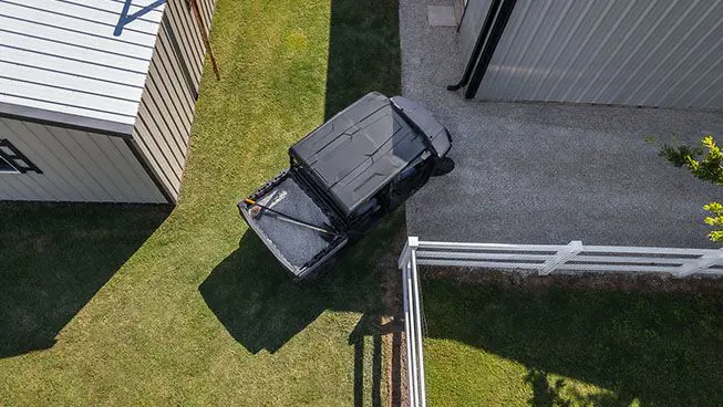 aerial view of a ranger crew sp 570 taking a tight corner on a farm