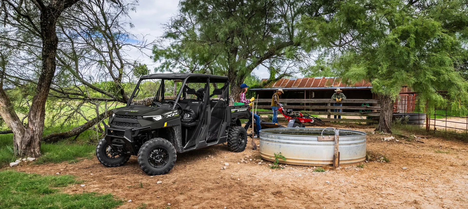 family using their ranger crew xp 1000 utv for hard work on the farm