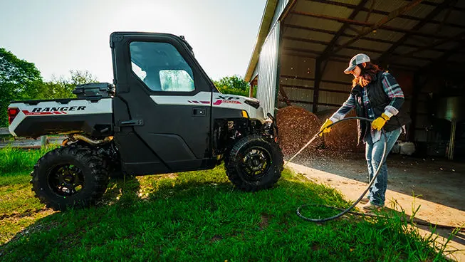 farmer washing her ranger xp 1000 northstar edition trail boss utv