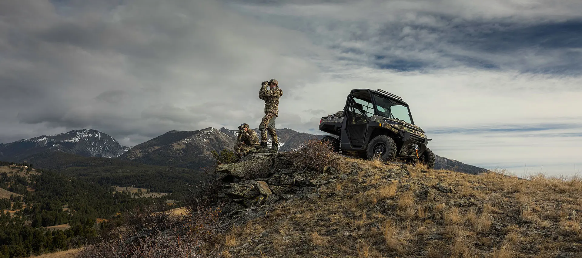 hunters scoping out the land near their polaris ranger xp kinetic electric UTV